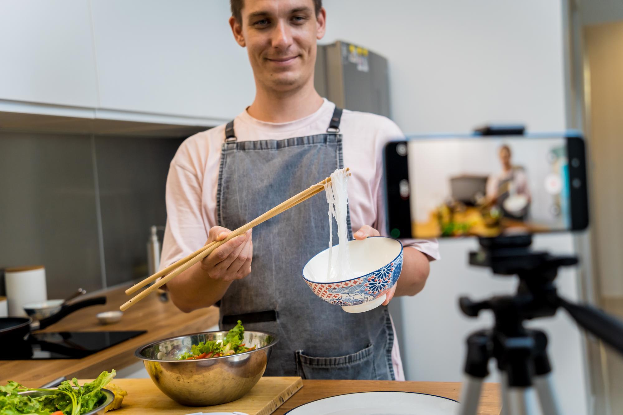 Chef teaching online with ingredients on table